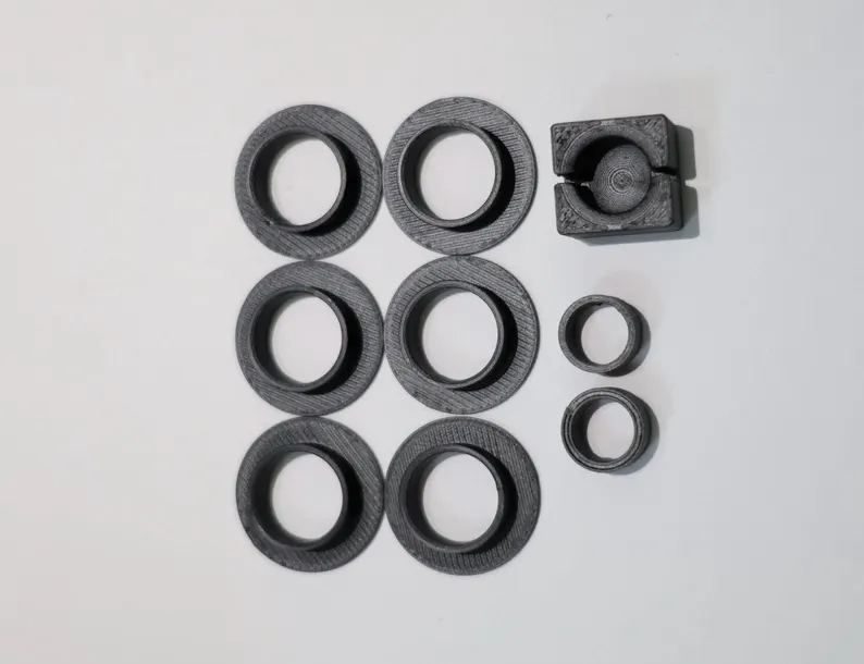 The 9 printed pieces of the Honda Acty shift linkage bushing kit